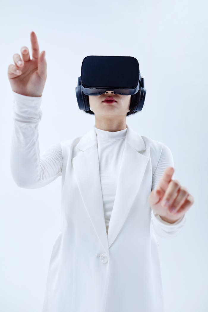 Services-03 Woman using VR headset, exploring technology in a white setting.